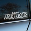 Plotrovaná nálepka s nápisom „AMBITIOUS“, japonskými znakmi a textom „FOLLOW YOUR DREAM“ v minimalistickom dizajne.