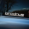 Plotrovaná nálepka na auto s logom Prodrive, futuristický font s predĺženou spodnou líniou pod celým nápisom.