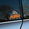 Tlačená nálepka na auto KTM Racing s motívom diviaka a výrazným logom značky pre fanúšikov motokrosu a rýchlej jazdy.