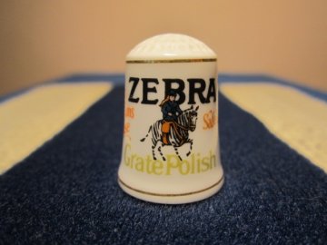 Sběratelský náprstek - Franklin Porcelain USA - Reklama 1982, ZEBRA - čistič