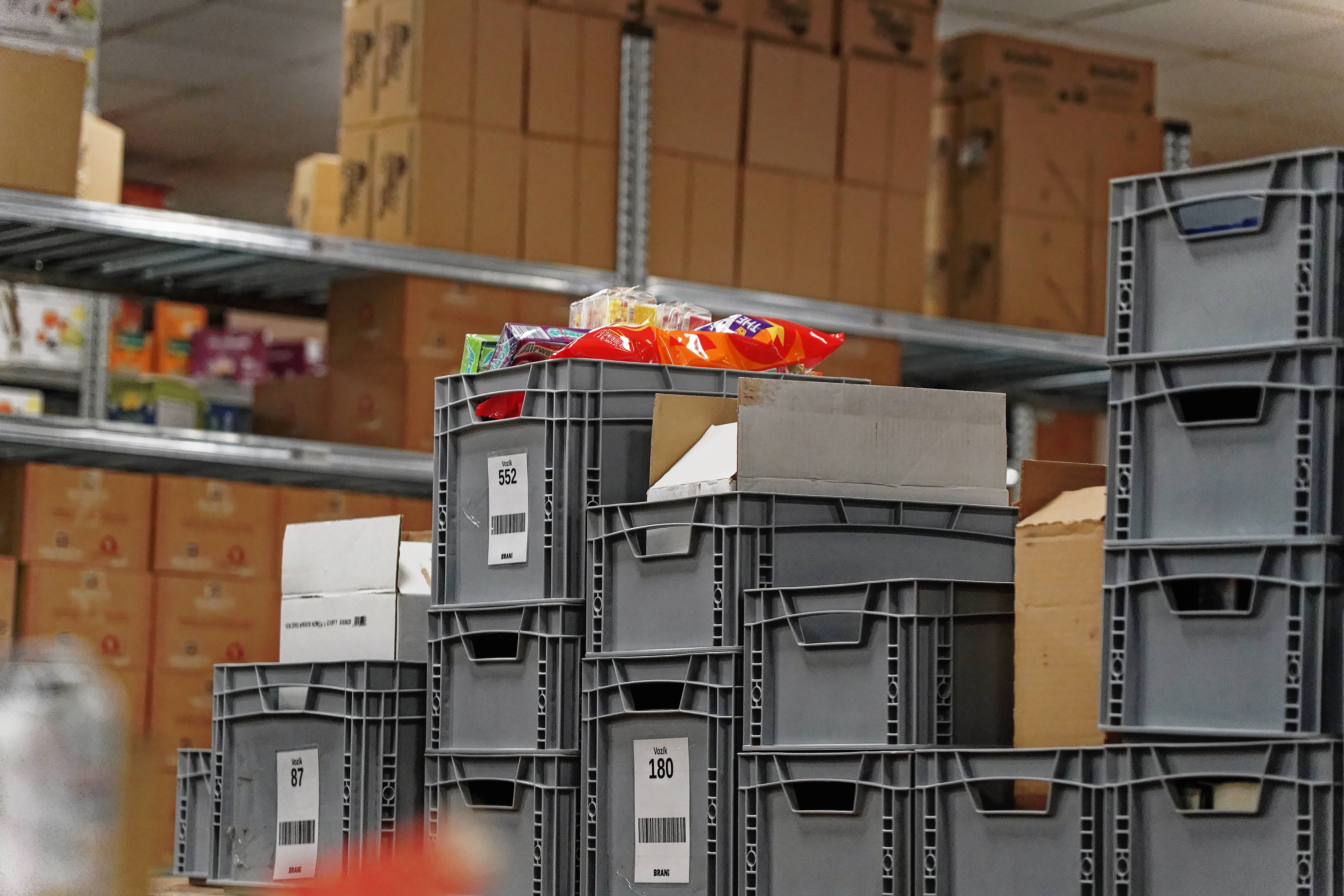 Numbered crates with picked orders waiting for packing