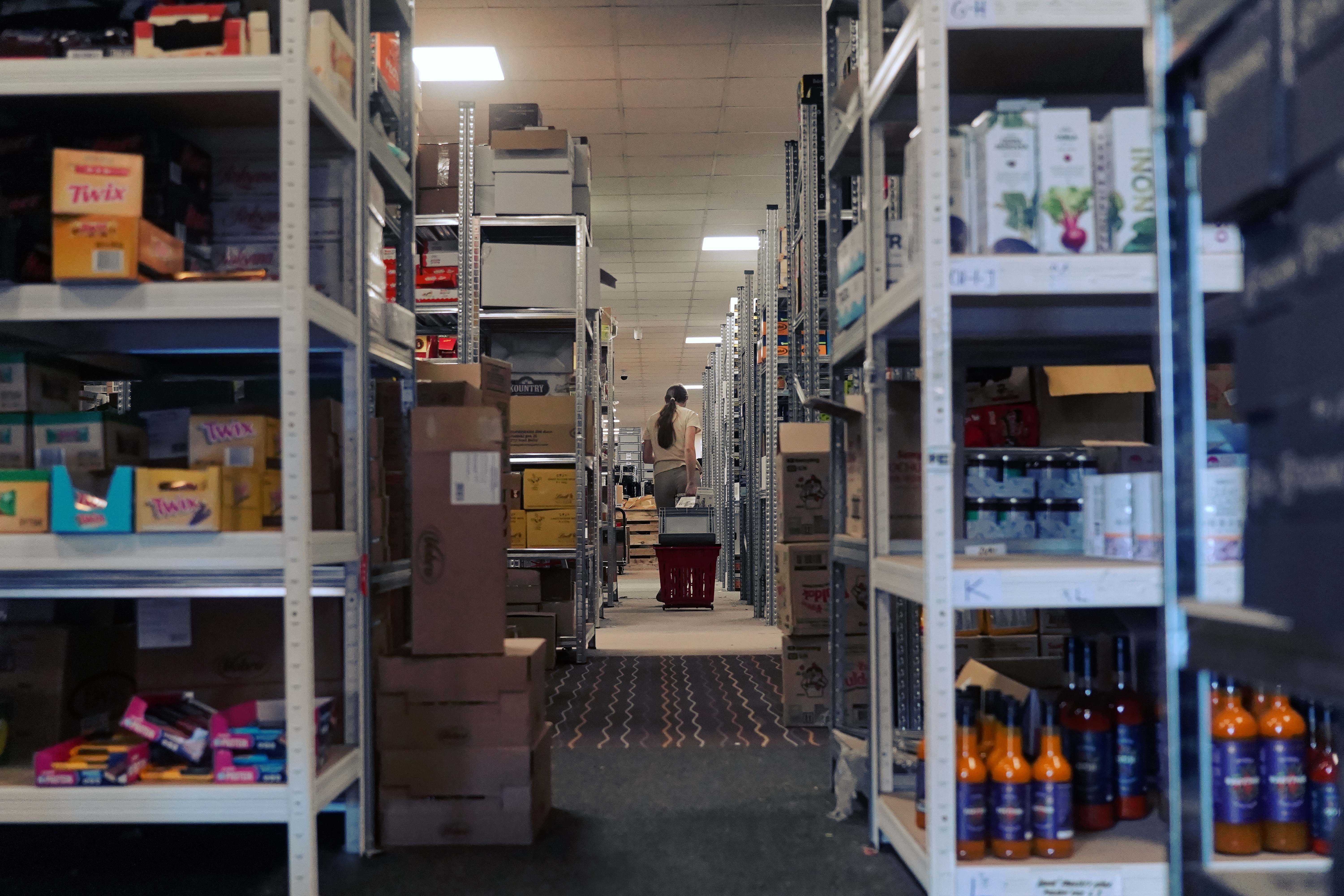 Colleague picking products from shelves in the Nejkafe warehouse