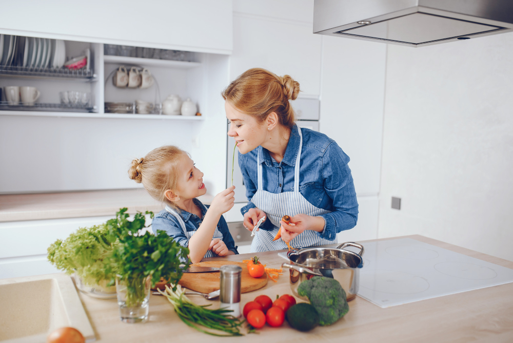 beautiful-mother-blue-shirt-apron-is-preparing-fresh-vegetable-salad-home