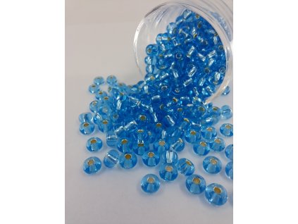 Rokajl Preciosa 5/0 - transparentní modrá - stříbrný průtah - 1 g