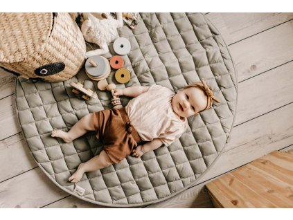 Playandgo organic collection playmat open detail meadow green baby lying on mat basket and wooden toys