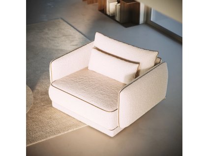 Kreslo METROPIA svetlé čalúnené kreslo v interiéri pri stene a dlažbe v mierne bočnom pohľade.