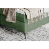 Boxspring posteľ - detail rohu a nohy - zelené čalúnenie a kovová noha