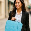 20250710 1447 Smiling Businesswoman with Bag remix 01jzt5y4bhfge8wng5da0ehr3s