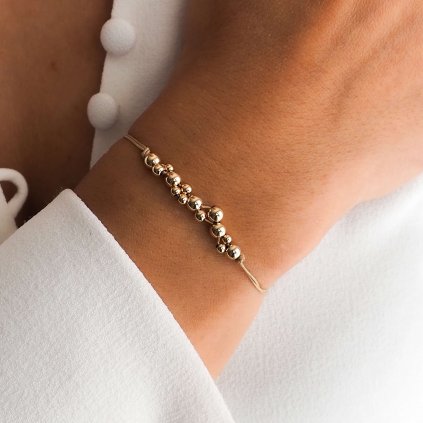 Náramek šňůrkový na ruku Bubble z gold filled materiálu Nufs Design