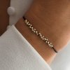 Náramek Bubble Minimal na šňůrce z materiálu gold Filled Nufs Design na černé šňůrce