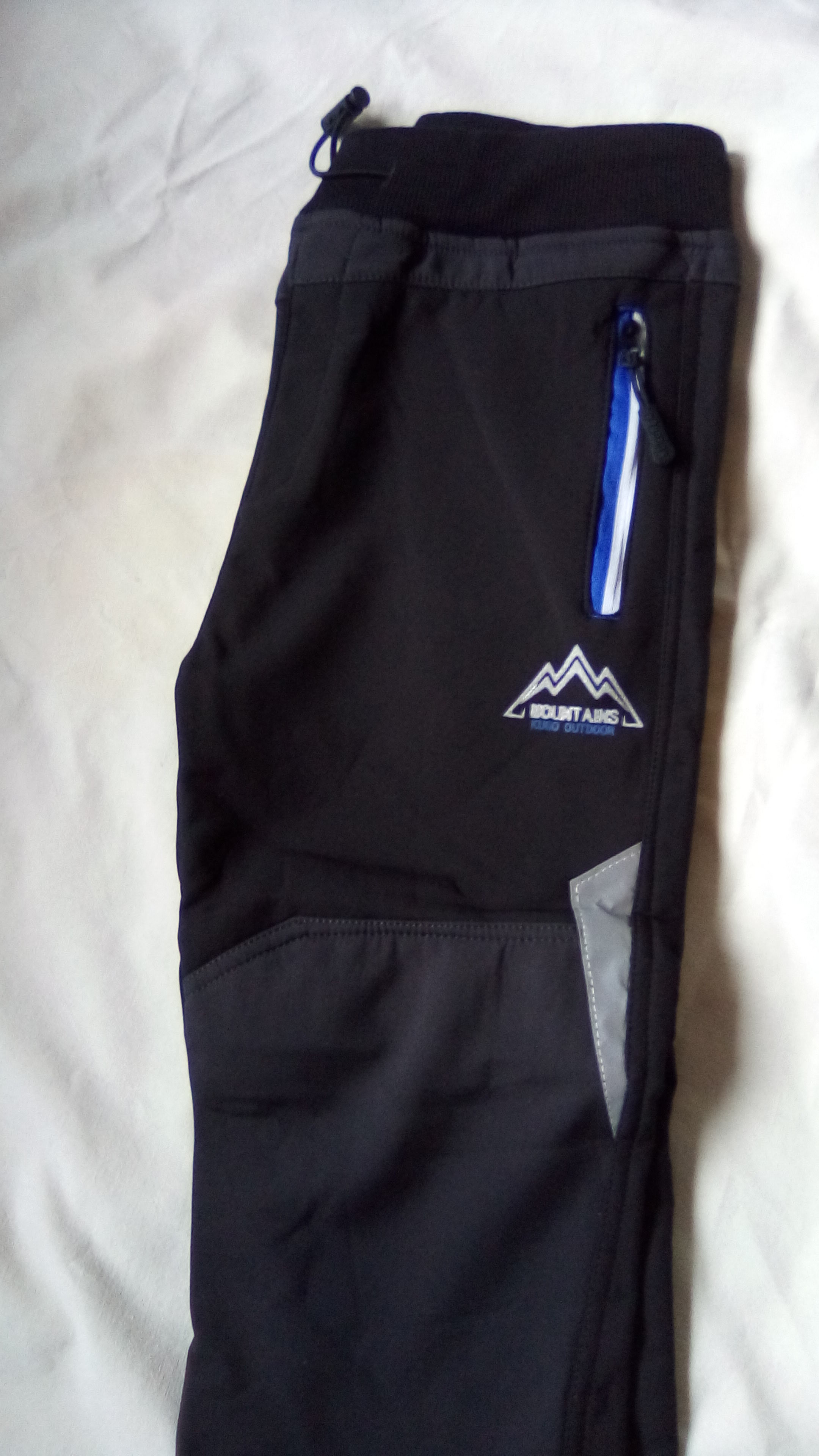 Kugo zateplené softshellové kalhoty (K1209) Barva: černé s modro-bílým zipem, Velikost: 122