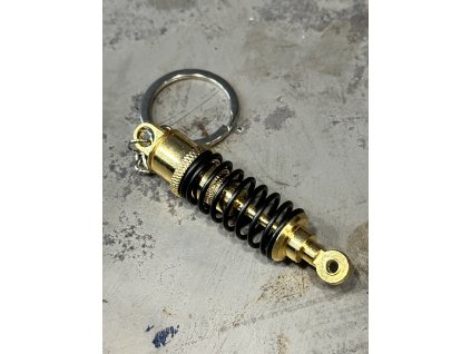 Kovová klíčenka tlumič co se dá stlačit zlatá (Velikost Unisex)