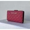 Michael Kors dámská peněženka Jet set travel Bifold medium dk raspberry