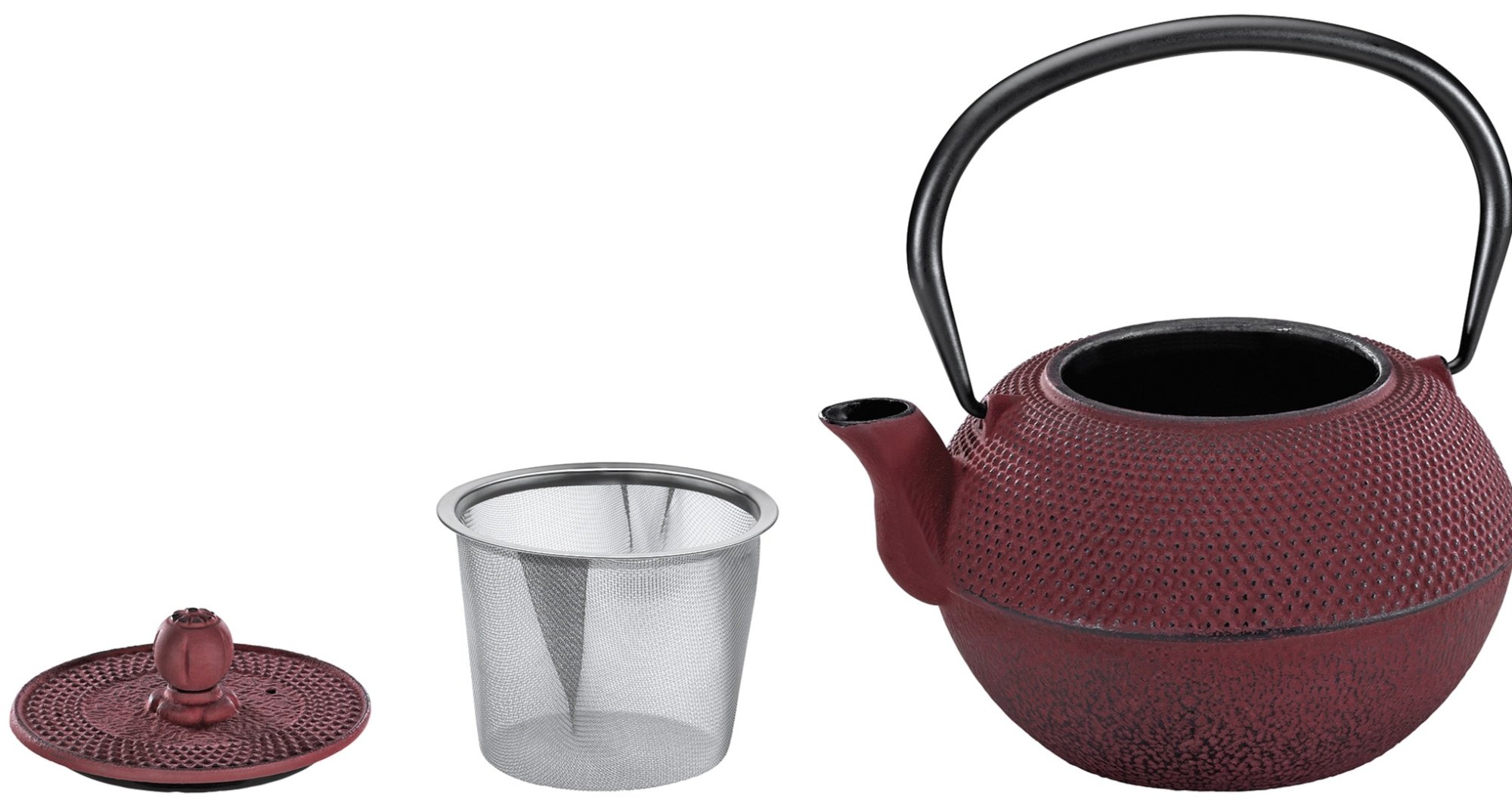 Litinové konvice a ohřívák na čajovou konvici.