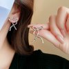 Irregular Silver Ribbon Texture Bow Earrings