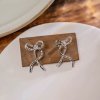 Irregular Silver Ribbon Texture Bow Earrings