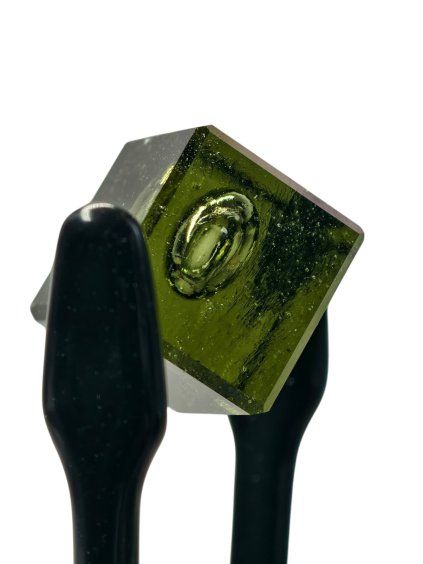 Unique cut moldavite cube with a bubble 17,5ct