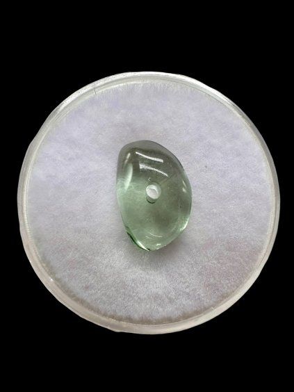 Moldavite bead with a drilled hole