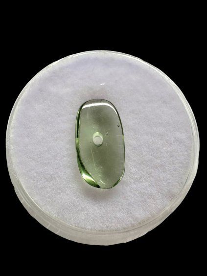 Moldavite bead with a drilled hole