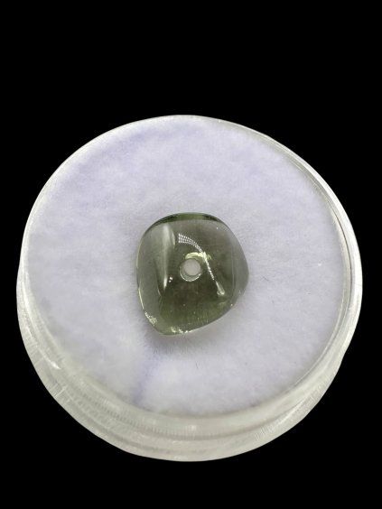 Moldavite bead with a drilled hole