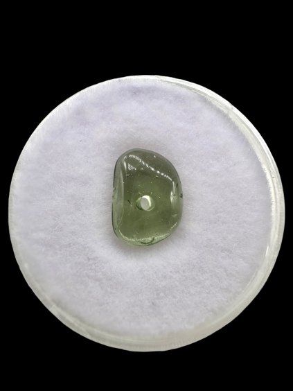 Moldavite bead with a drilled hole