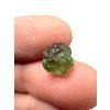 A bead made of raw moldavite – random piece