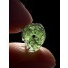 A bead made of raw moldavite – random piece
