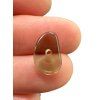 Moldavite bead with a drilled hole