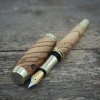Plnicí pero Portland L - Zebrano - zlaté (?ikmo řezané) 2
