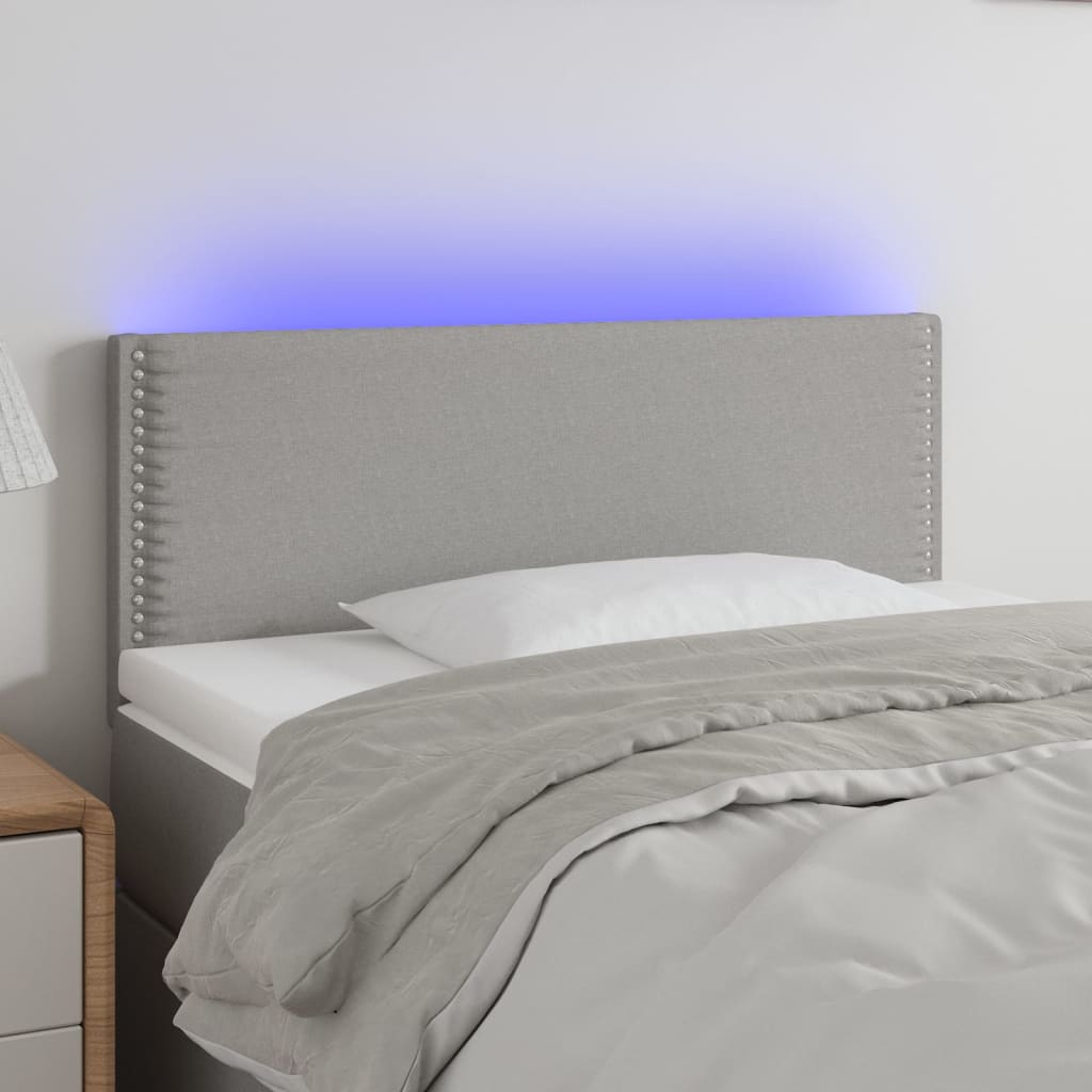 Čelo postele s LED světle šedé 90x5x78/88 cm textil