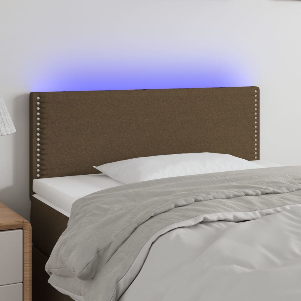 Čelo postele s LED tmavě hnědé 90x5x78/88 cm textil