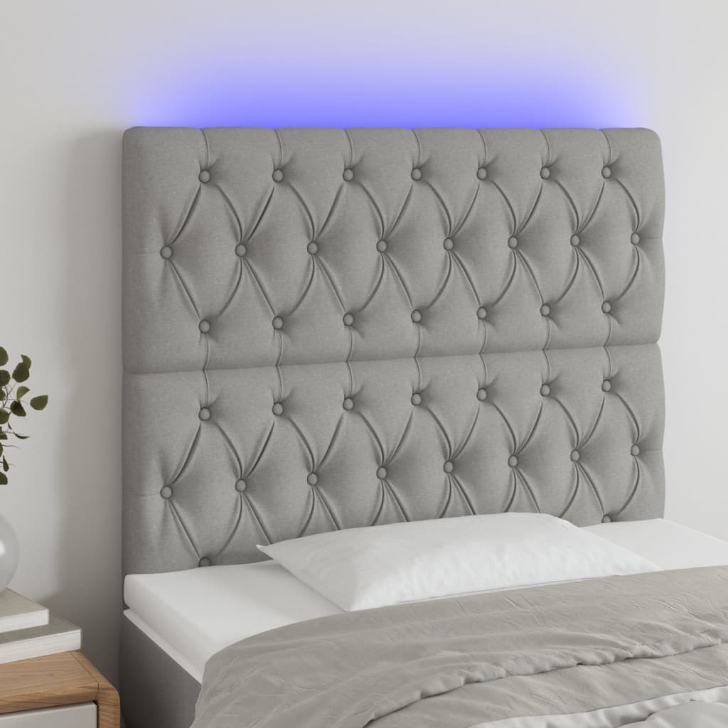 Čelo postele s LED světle šedé 100x7x118/128 cm textil