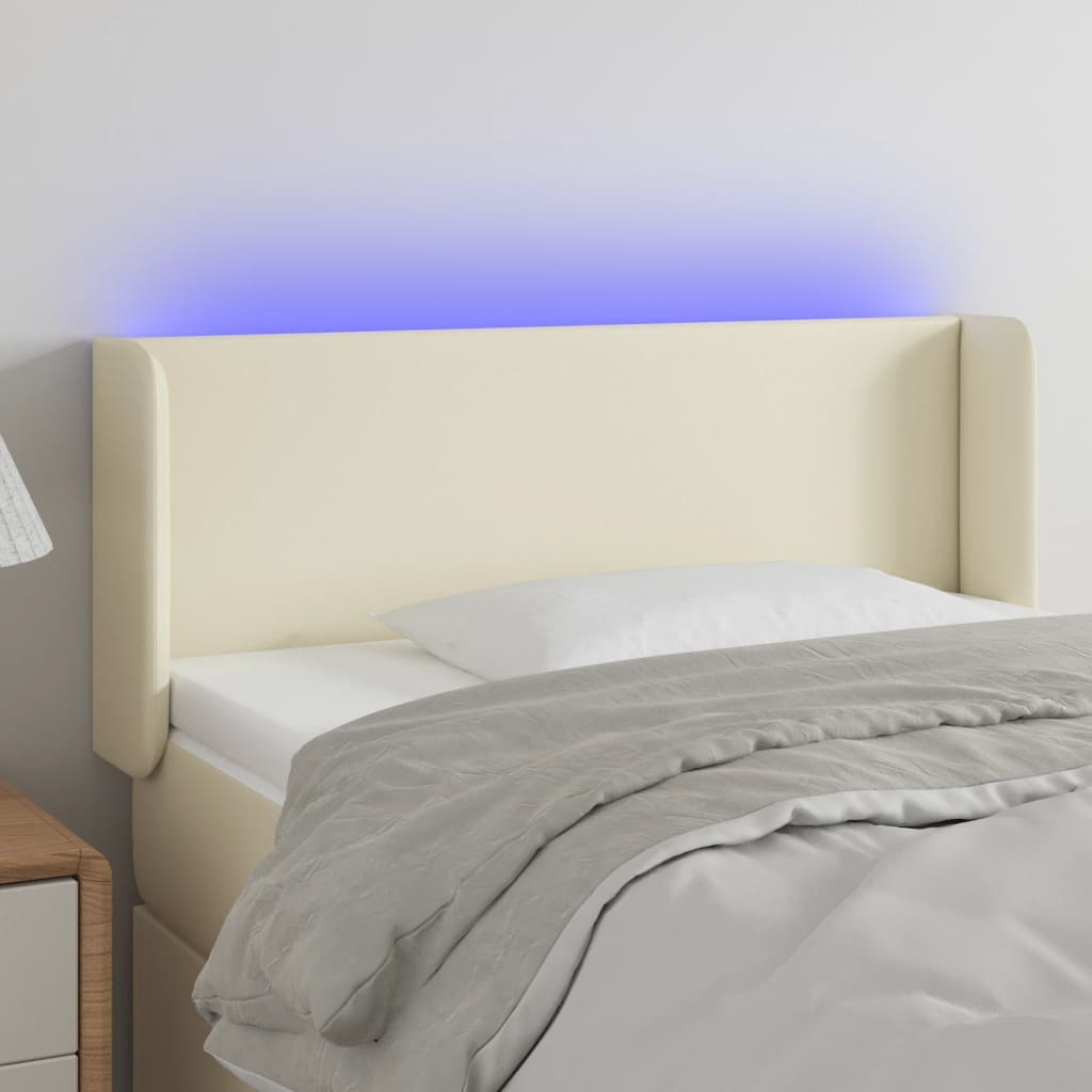 Čelo postele s LED krémové 103 x 16 x 78/88 cm umělá kůže