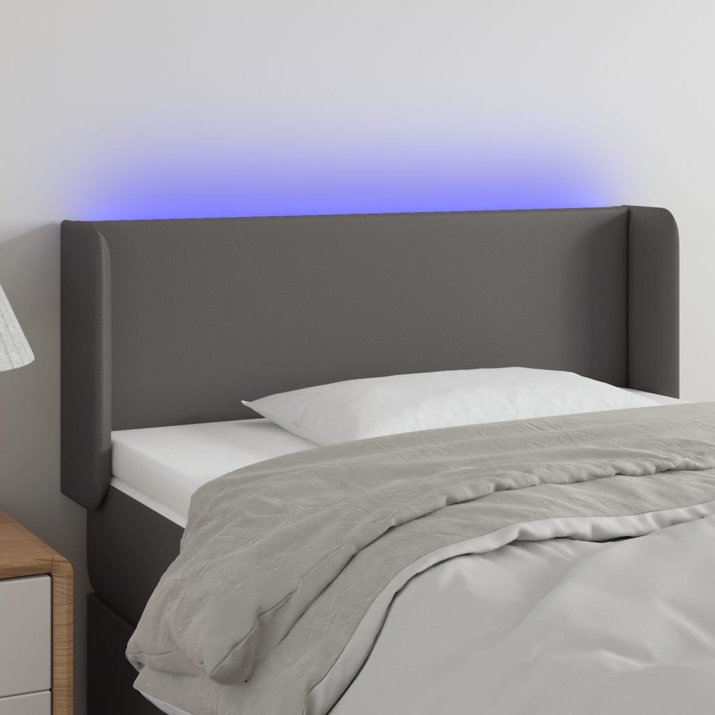 Čelo postele s LED šedé 103 x 16 x 78/88 cm umělá kůže