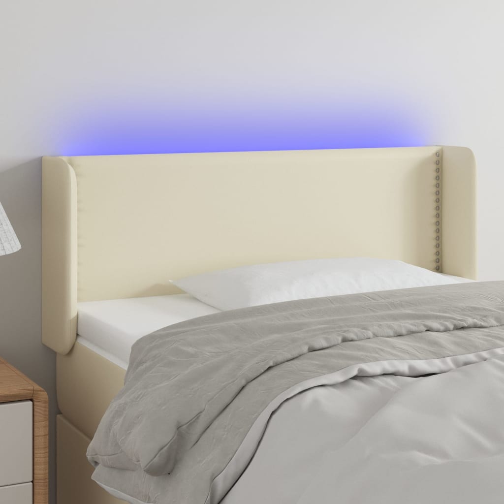 Čelo postele s LED krémové 103 x 16 x 78/88 cm umělá kůže