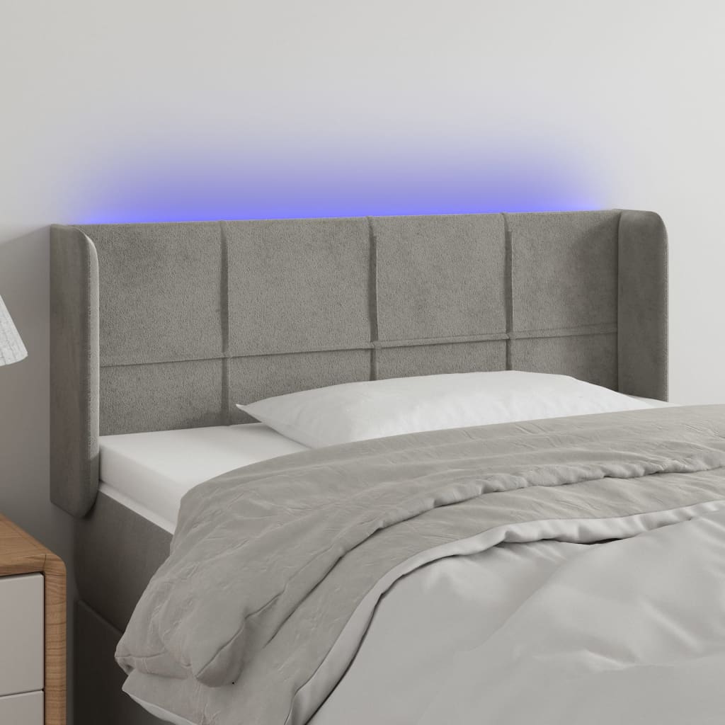 Čelo postele s LED světle šedé 83 x 16 x 78/88 cm samet