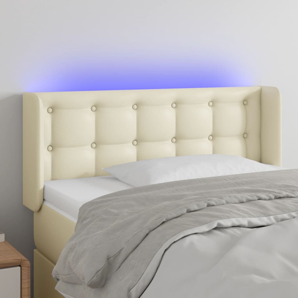 Čelo postele s LED krémové 103 x 16 x 78/88 cm umělá kůže