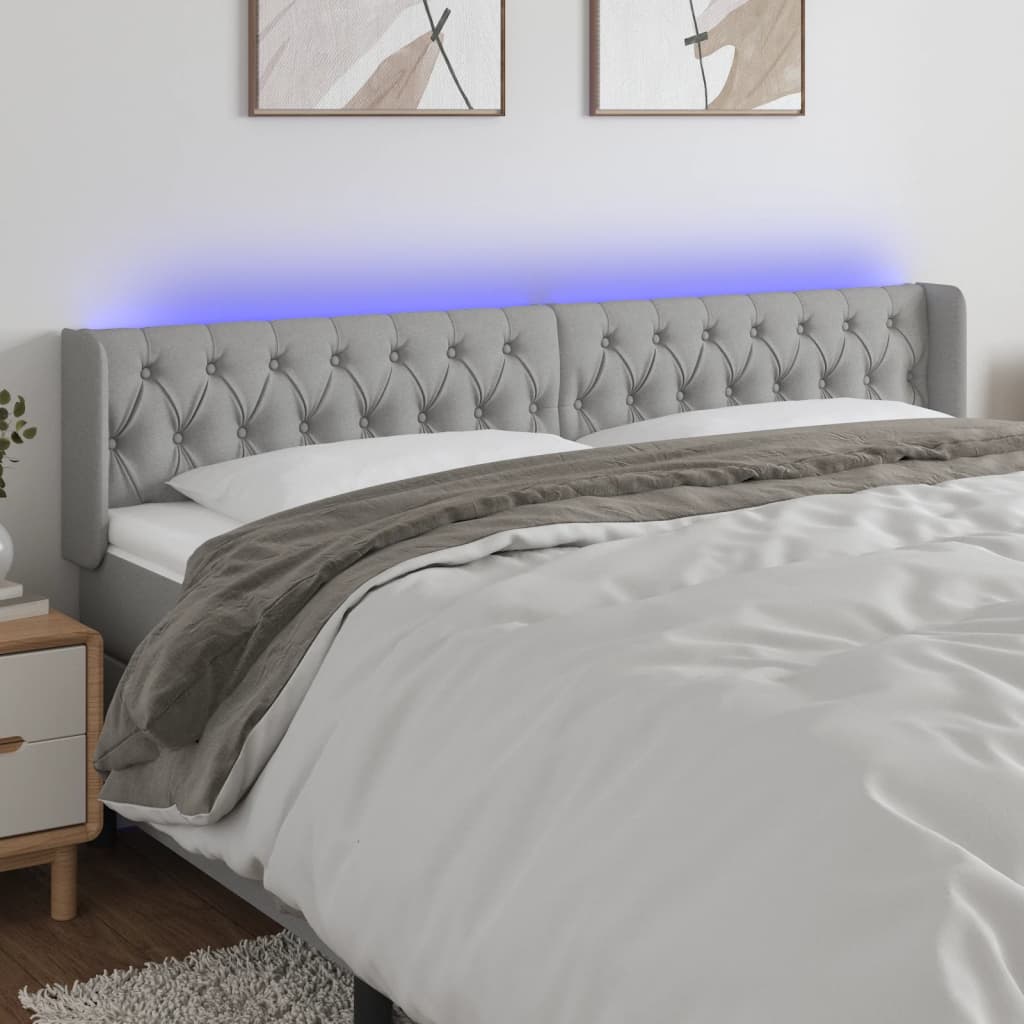 Čelo postele s LED světle šedé 203 x 16 x 78/88 cm textil