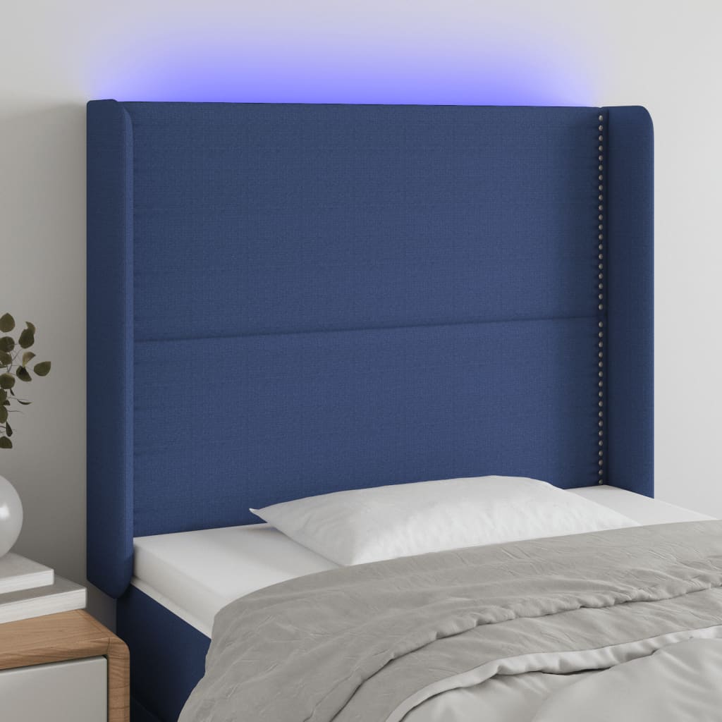 Čelo postele s LED modré 103 x 16 x 118/128 cm textil