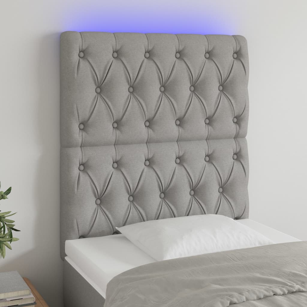 Čelo postele s LED světle šedé 80x7x118/128 cm textil