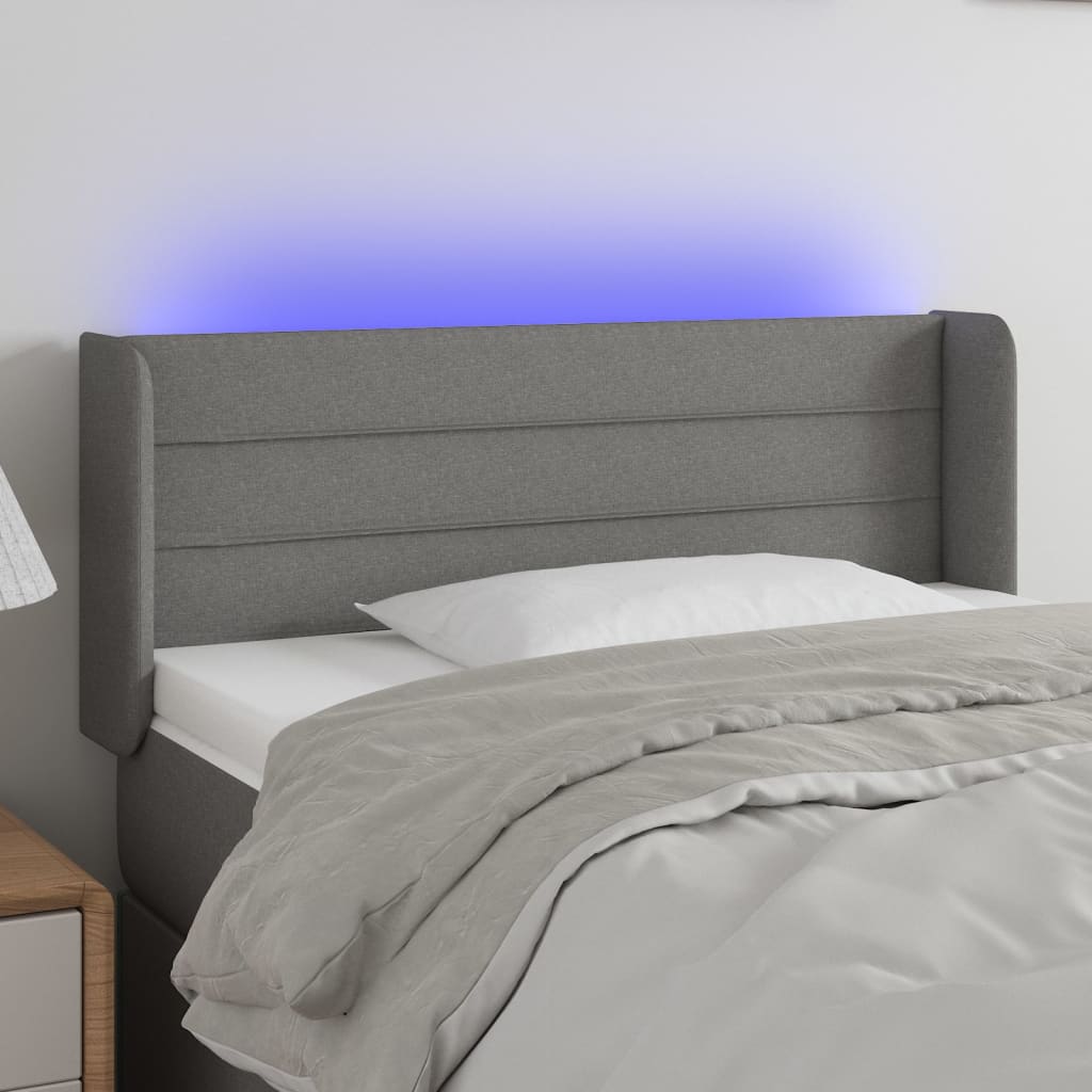 Čelo postele s LED tmavě šedé 83 x 16 x 78/88 cm textil