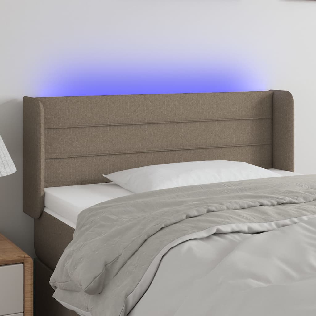 Čelo postele s LED taupe 83 x 16 x 78/88 cm textil