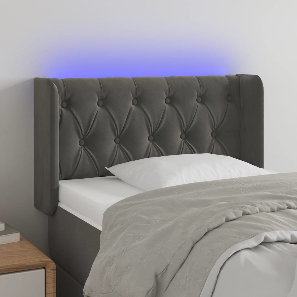 Čelo postele s LED tmavě šedé 83 x 16 x 78/88 cm samet