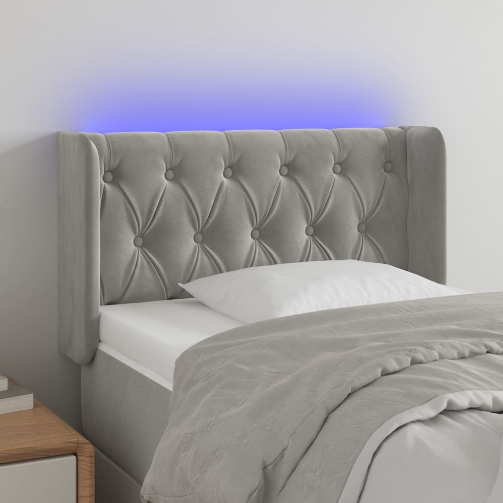 Čelo postele s LED světle šedé 83 x 16 x 78/88 cm samet