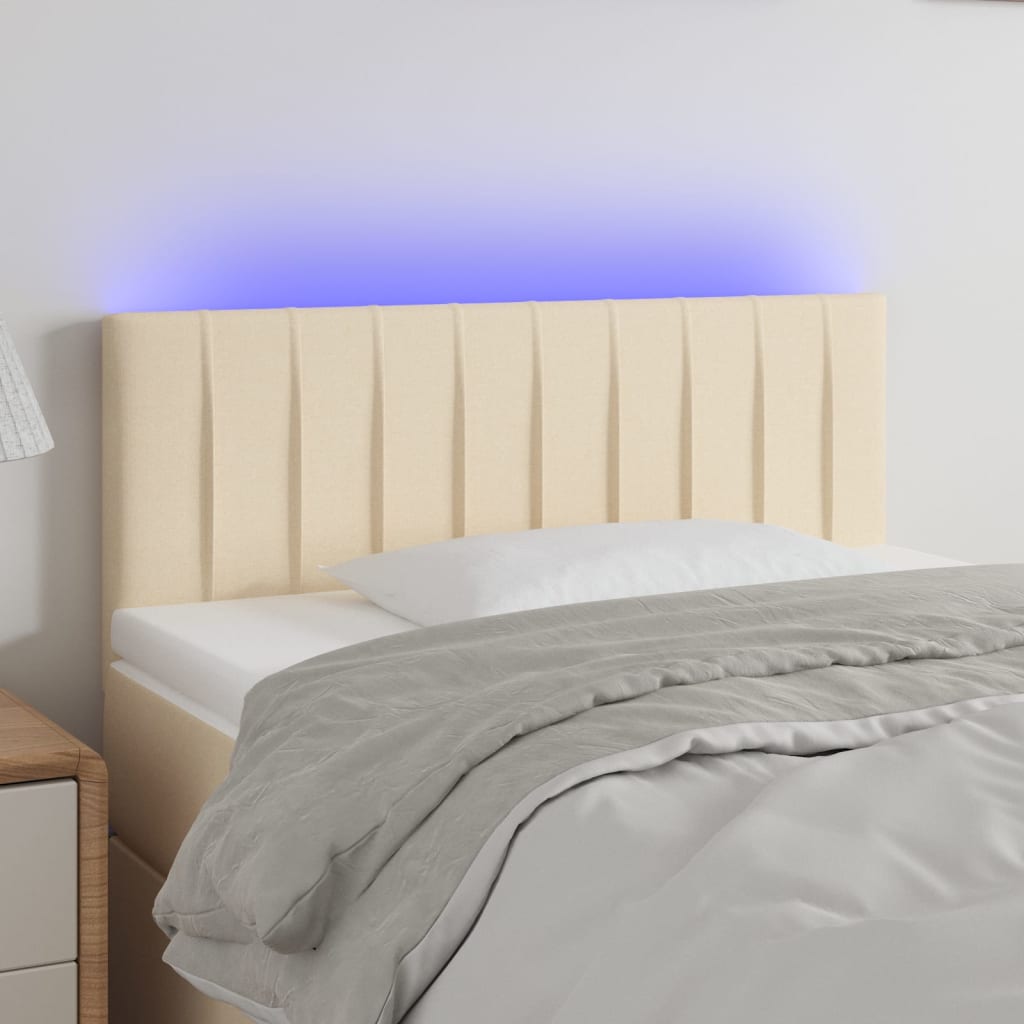 Čelo postele s LED krémové 80 x 5 x 78/88 cm textil