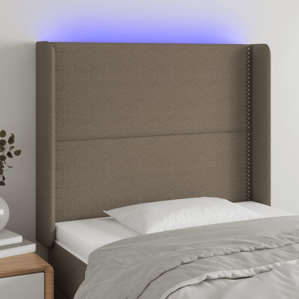 Čelo postele s LED taupe 83 x 16 x 118/128 cm textil