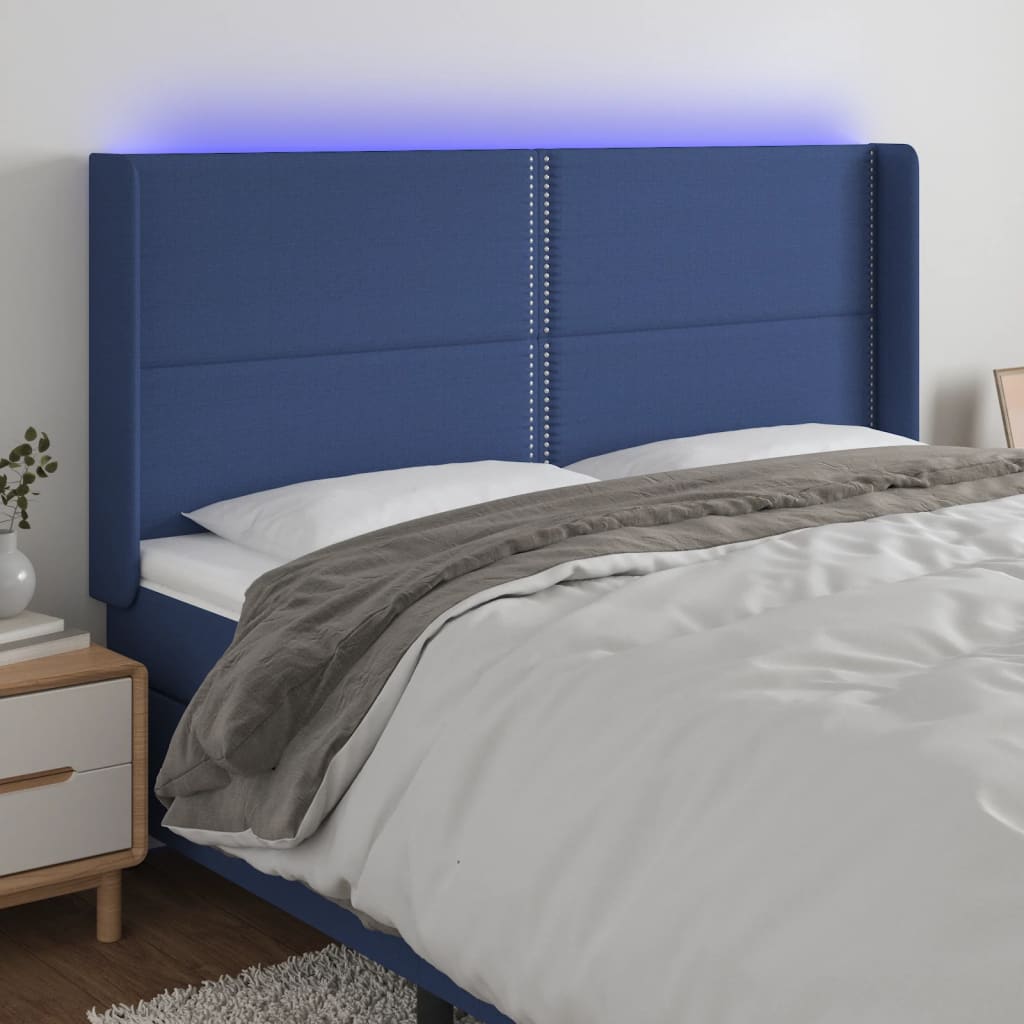 Čelo postele s LED modré 163 x 16 x 118/128 cm textil