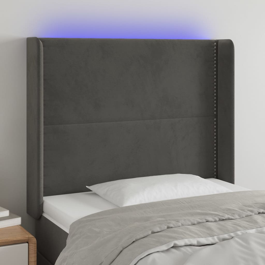 Čelo postele s LED tmavě šedé 83 x 16 x 118/128 cm samet