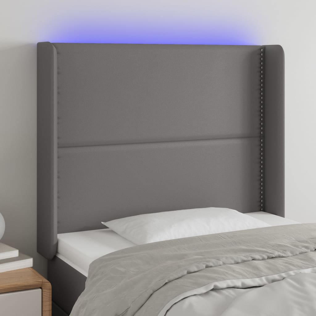 Čelo postele s LED šedé 83 x 16 x 118/128 cm umělá kůže