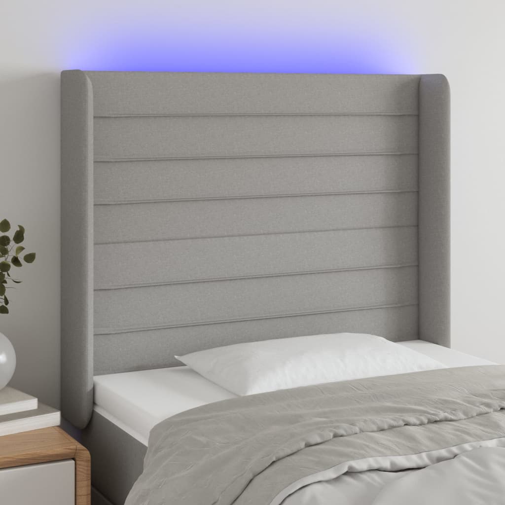 Čelo postele s LED světle šedé 103x16x118/128 cm textil